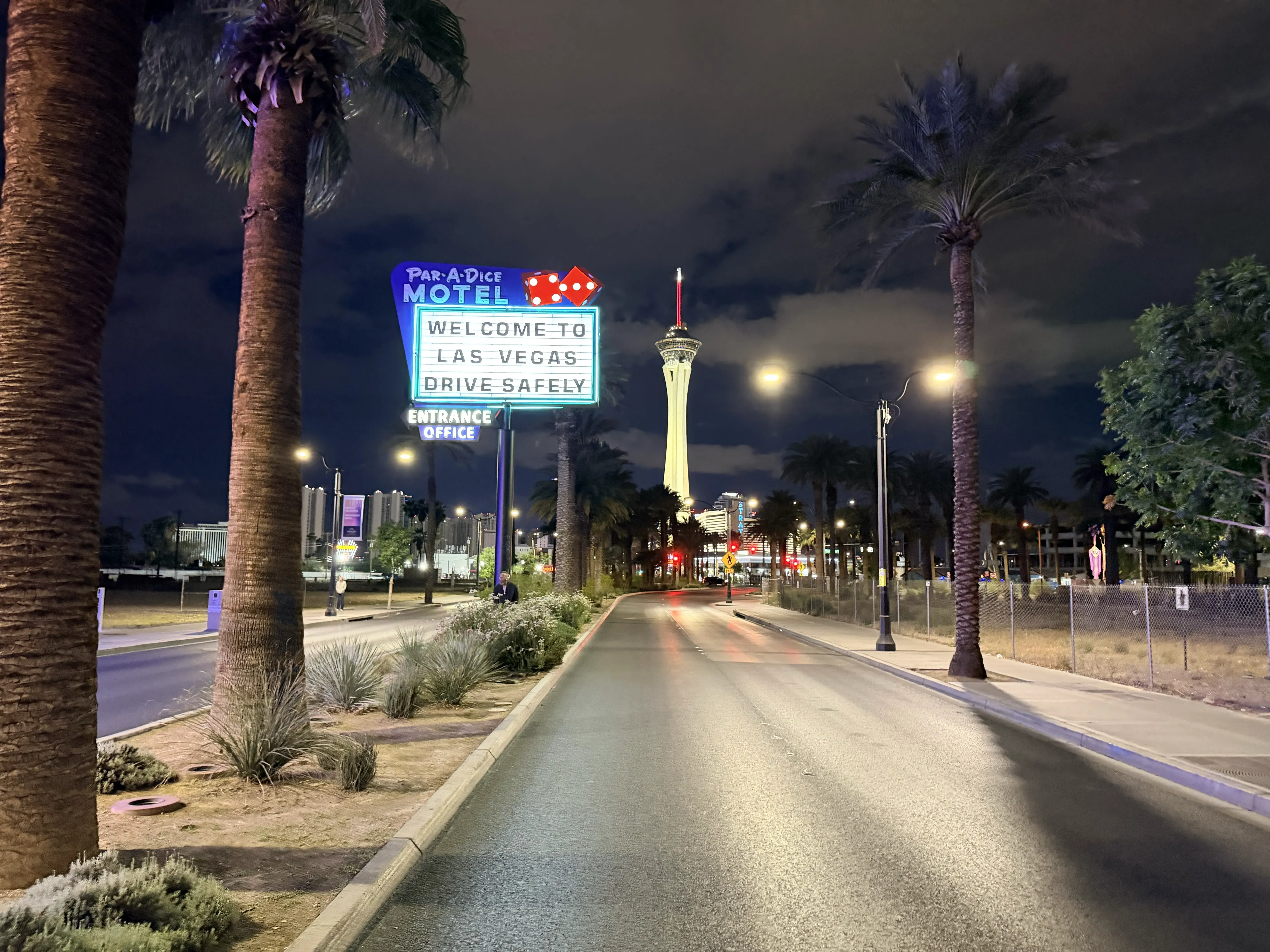 Par-A-Dice Motel and Stratosphere at night, empty road