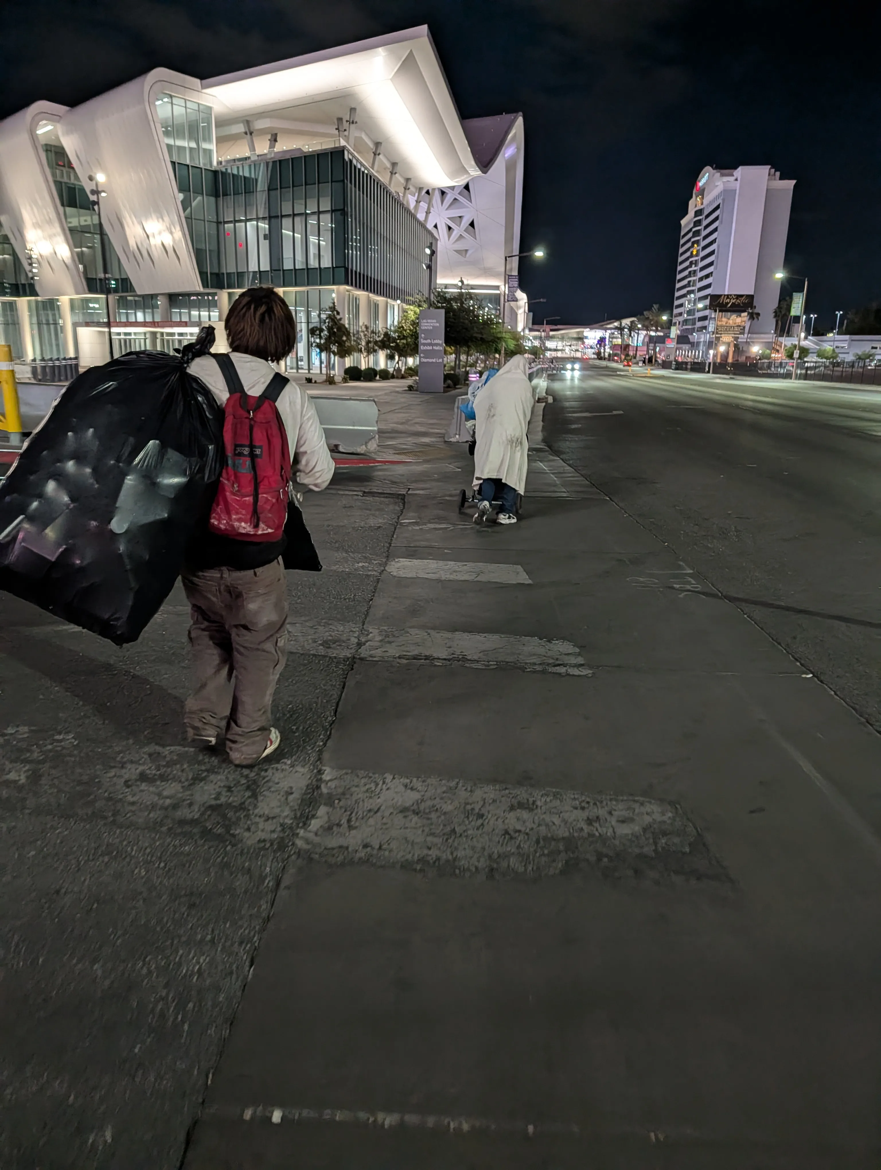 Men with shopping carts near Convention Center